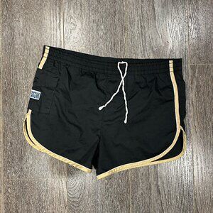 Laguna 1980s-era black swim trunks with gold contrast trim